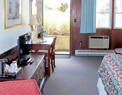 Sea Whale Motel garden room with one queen bed and sleeper sofa